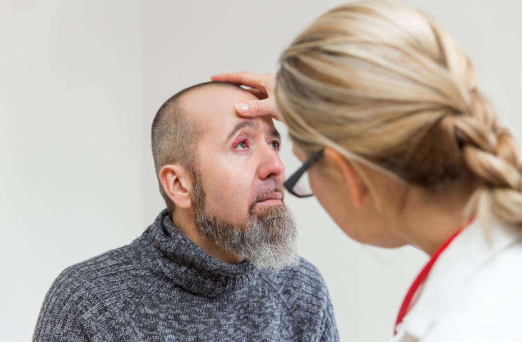 A man with a stye is feeling something in his eye and went to see his doctor for an eye examination.