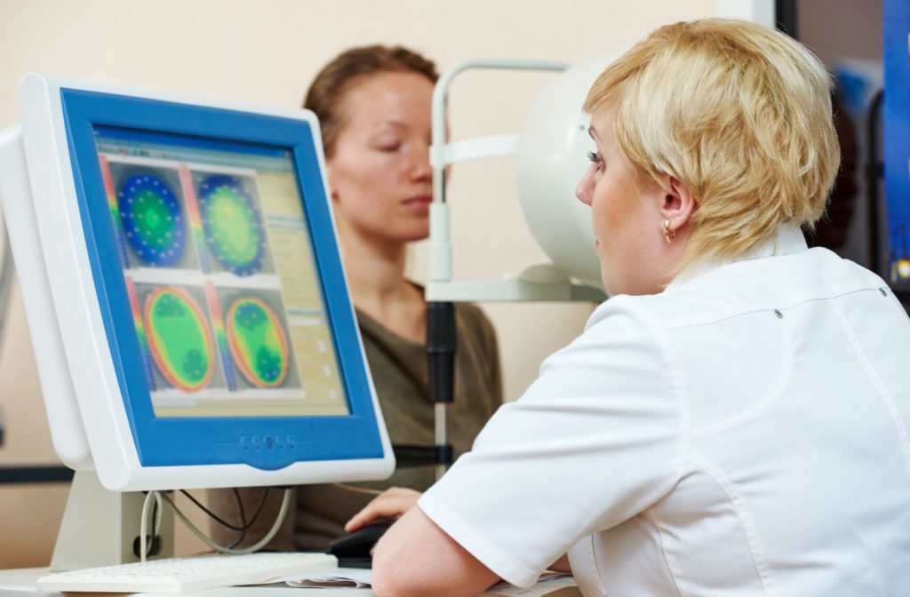 An ophthalmologist mapping the corneas of her patient.